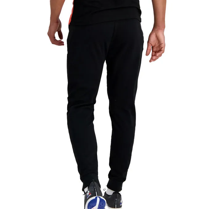 JOGGERS TRAINING PERFORMANCE Man Black Orange